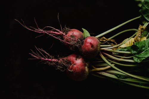 Close-Up Photo of Beetroots on Black Background