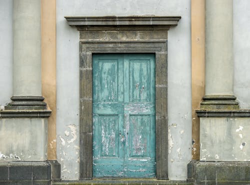 Free A Dilapidated Blue Wooden Door Stock Photo