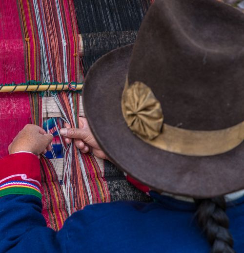 Free A close-up view of hands weaving with traditional colorful threads, showcasing cultural craftsmanship. Stock Photo