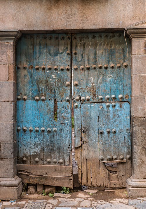 A Dilapidated Blue Wooden Door
