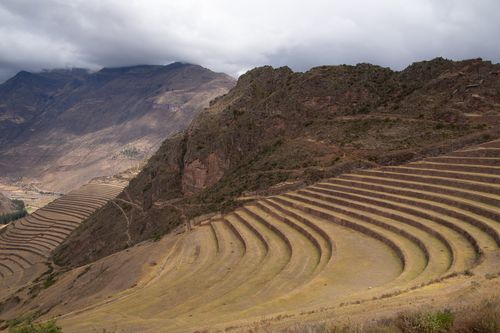 Free Majestic view of ancient agricultural terraces in the Andes under a cloudy sky. Stock Photo