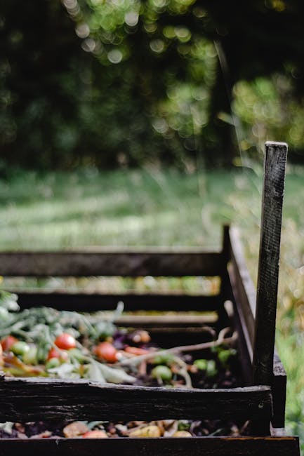 A compost bin overflowing with vegetable scraps and other organic waste.