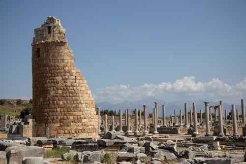 Free Explore the historic ruins of Perge in Antalya, Turkey, featuring ancient columns and stone structures. Stock Photo