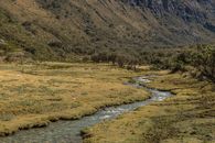 Mountain River Meandering in Wide Valley 