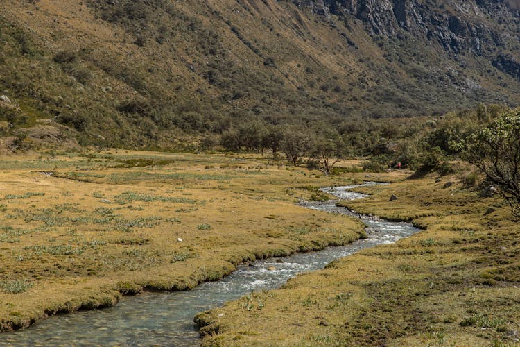 Mountain River Meandering In Wide Valley 