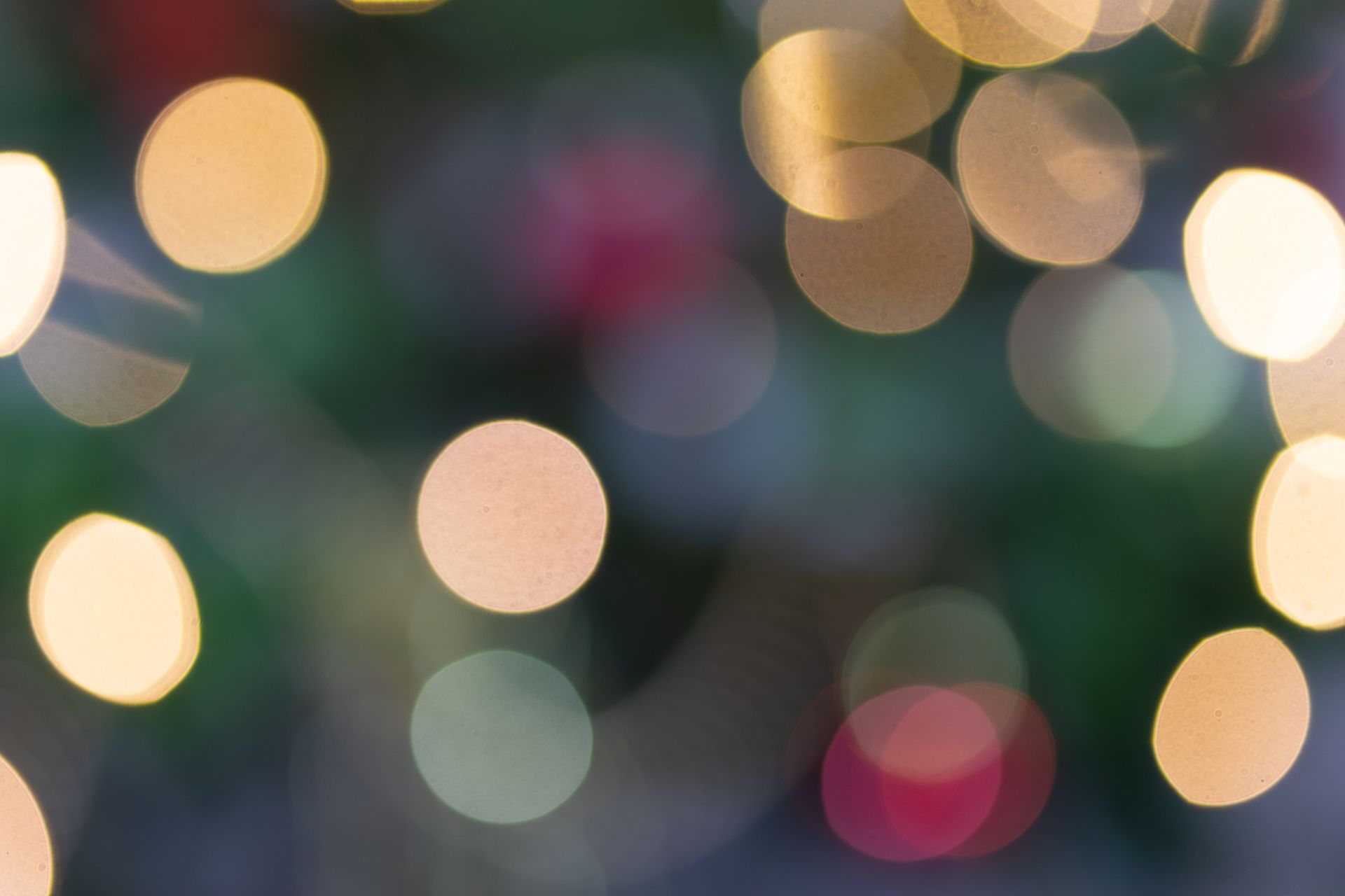 Vibrant bokeh image featuring defocused illuminated lights in various colors, creating a festive atmosphere.