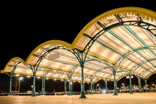 Lit Up Arches and Roof over a Train Station