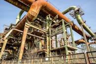 Low Angle View of an Old Industrial Site with Rusted Pipes