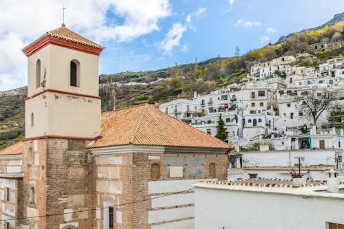A Chapel and White Buildings in a Town in Spain