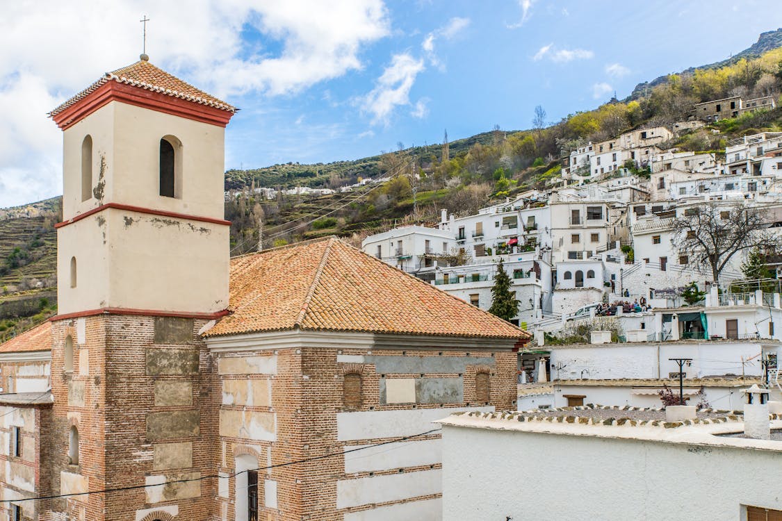Free A Chapel and White Buildings in a Town in Spain Stock Photo