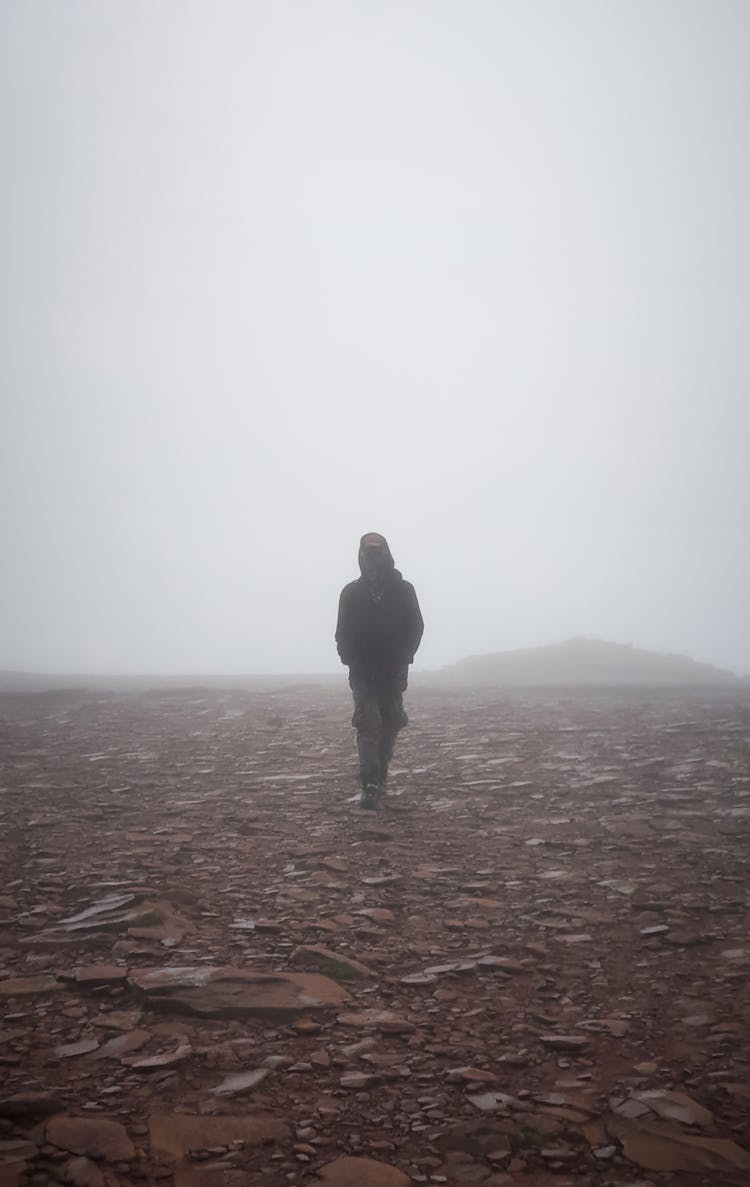 Silhouette Of Man Walking On Empty Surface