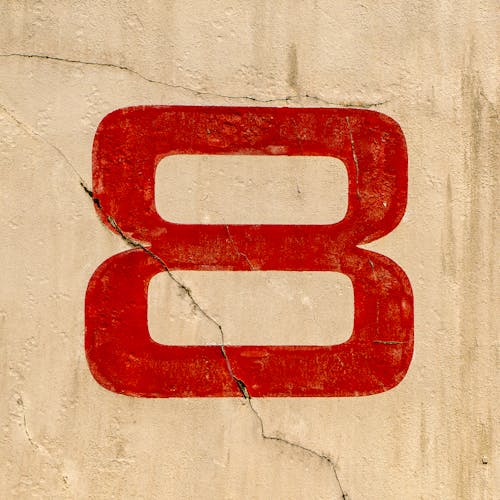 Number Eight Painted on Cracked Wall