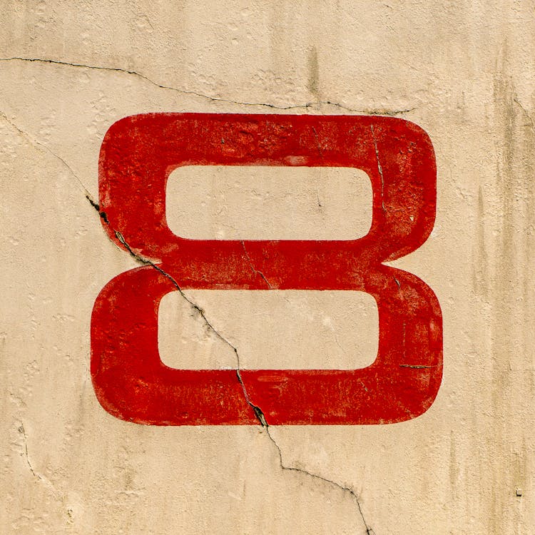 Number Eight Painted On Cracked Wall