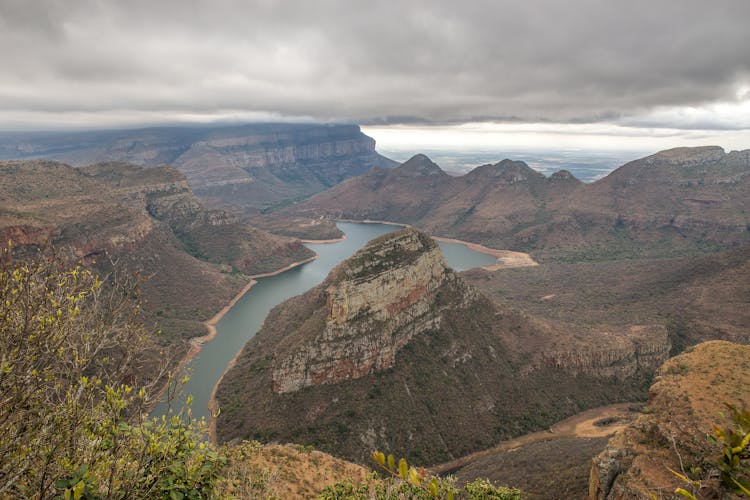 Aerial View Of River Flowing Through Rocky Canyons