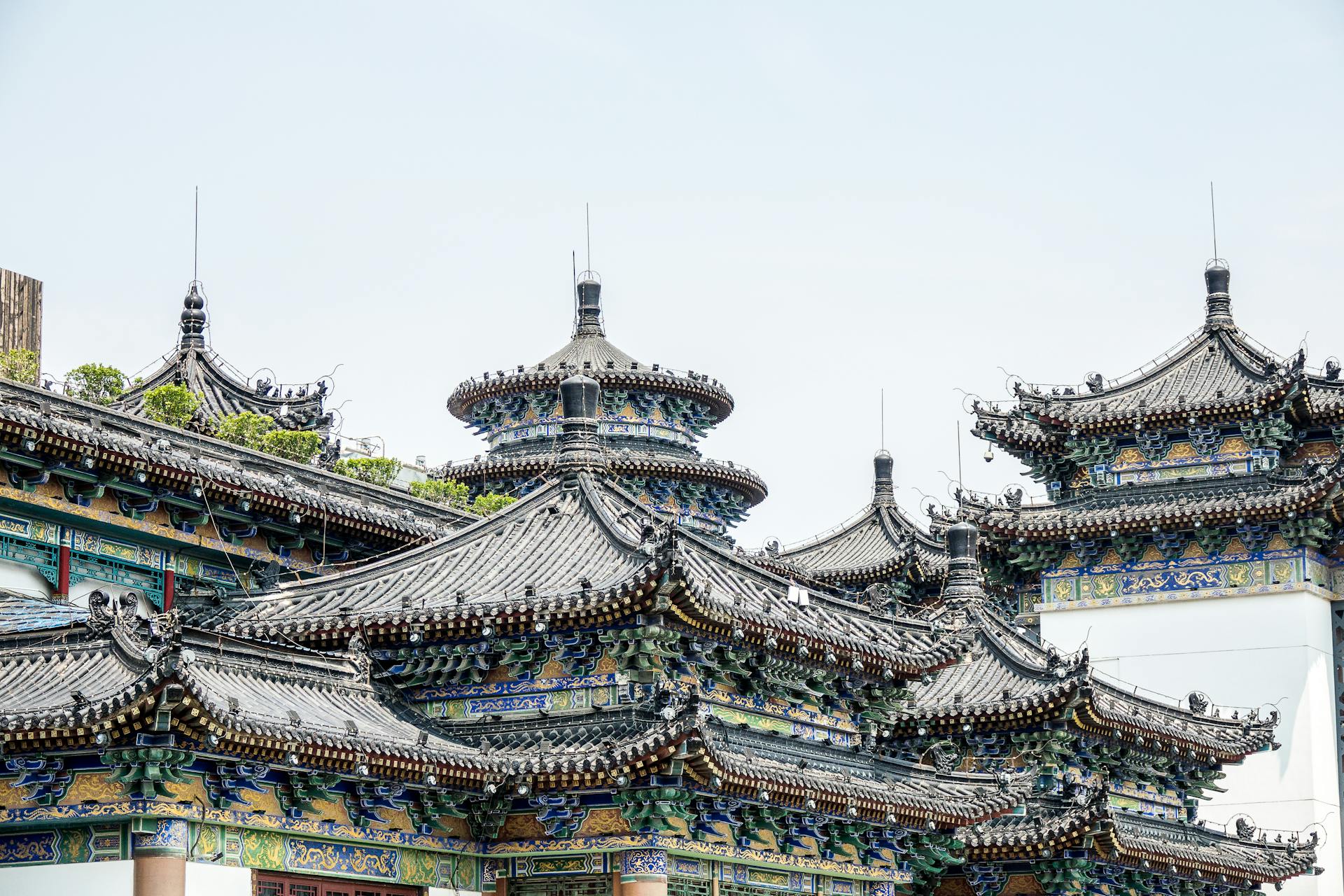 A close-up view of traditional Asian style temple rooftops showcasing intricate design and cultural heritage.