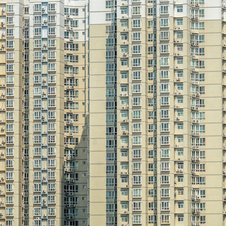 Windows Of Yellow High Rise Concrete Building