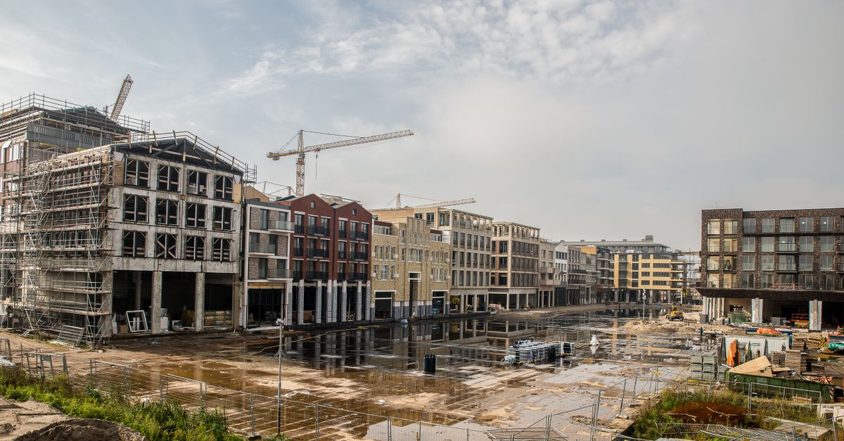 Photo by Mike van Schoonderwalt A modern construction site with buildings and cranes showcasing urban development.