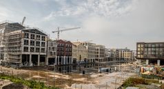Brown and White Concrete Building Under White Clouds