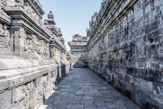 Explore the detailed carvings and stonework in this ancient temple corridor.