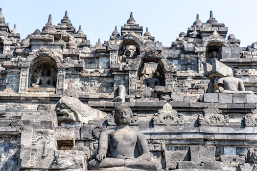 Close-up view of ancient stone sculptures and architecture at Borobudur Temple, Indonesia.