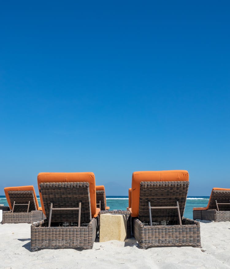 Deckchairs On Beach