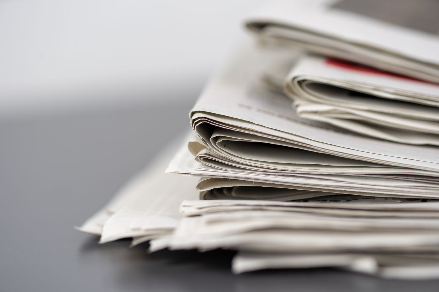 Folded newspapers on a table