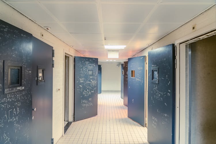 Hallway With Open Gray Doors