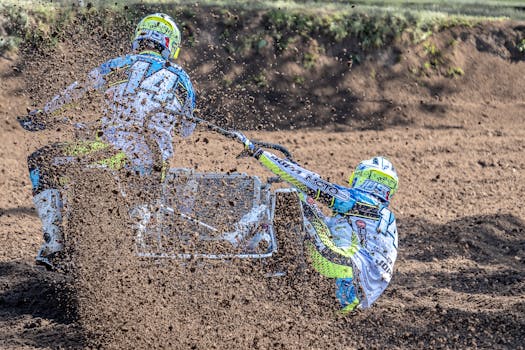 Dynamic shot of a motocross sidecar team racing on a muddy track, showcasing speed and teamwork.