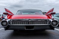 Back View of a Red Cadillac Fleetwood Classic Car