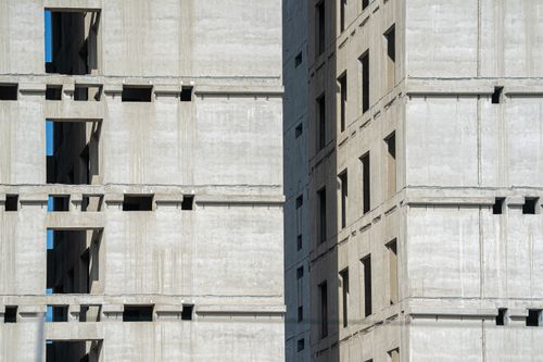 Free Close-up of an unfinished high-rise building with concrete structure. Stock Photo