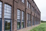 Brown Brick Building With Glass Windows