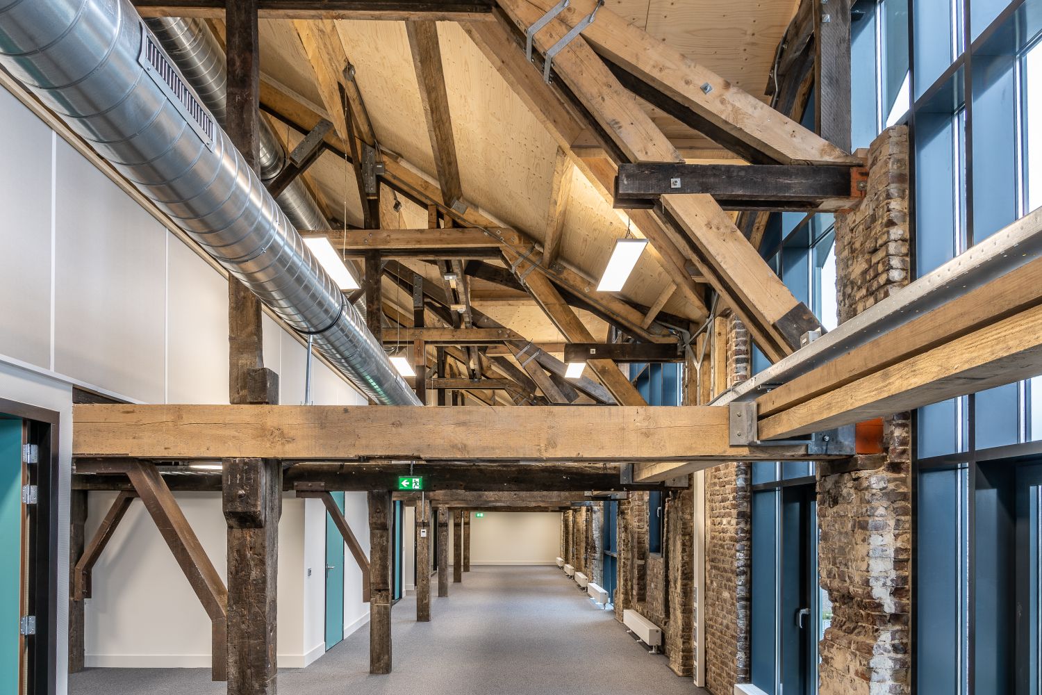 Spacious interior with industrial ductwork showcasing modern renovation style