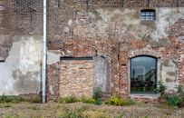 Brown Brick Building With Glass Window