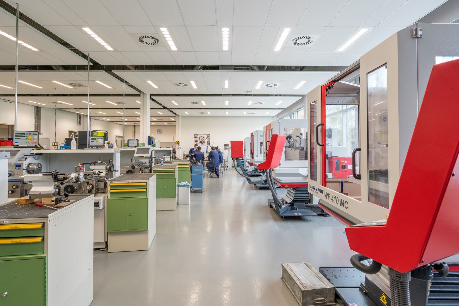 Spacious modern fabrication workshop with machinery