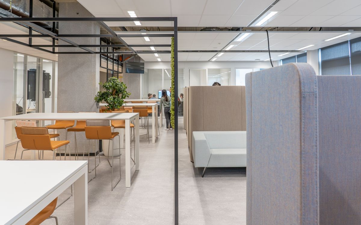 A sleek, contemporary office space featuring minimalist design and open layout with modern furniture.