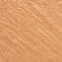 Warm rippled sand texture — Olga V on Pexels