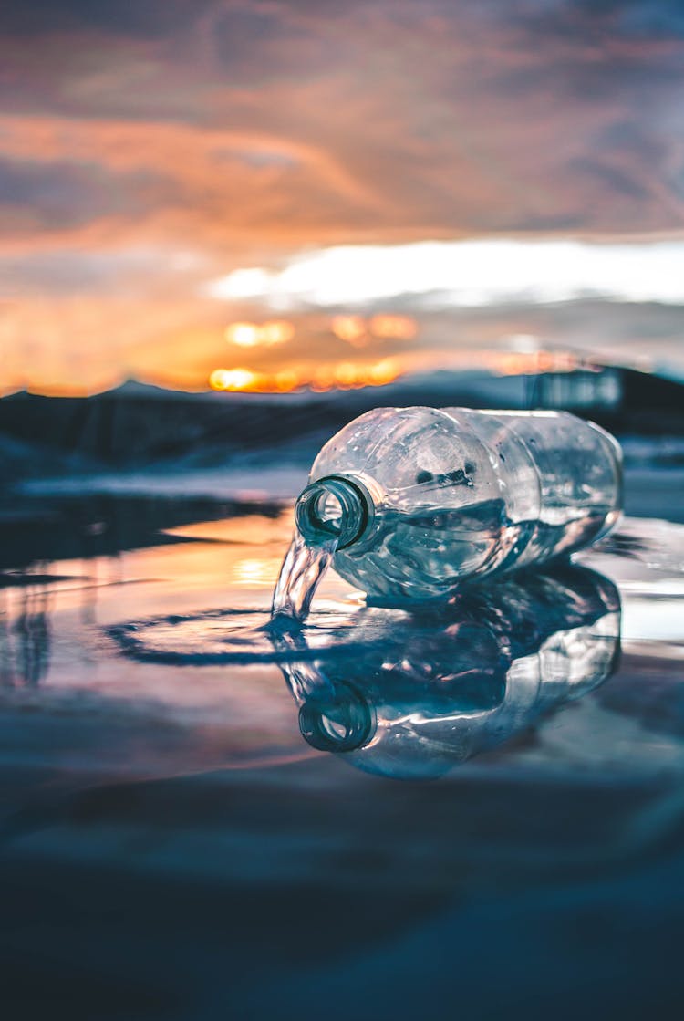 Plastic Bottle And Spilled Water