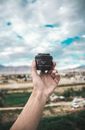 Person Holding Black Dslr Camera