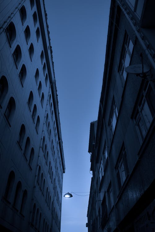 A Low Angle Shot of High Rise Buildings Under the Blue Sky