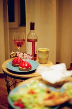 Intimate birthday celebration featuring wine, cupcakes, and a warm atmosphere.