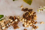 Brown Almond Nuts on White Table