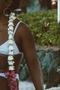 Flower Necklace on Unrecognizable African American Woman in Bikini