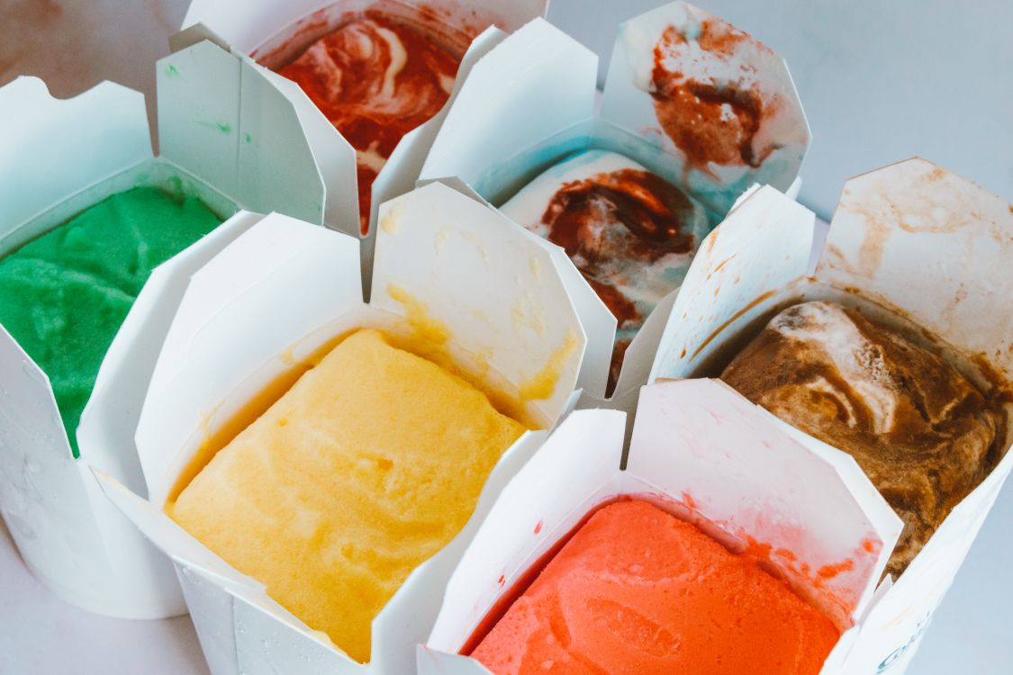 Colorful ice cream portions in small open containers