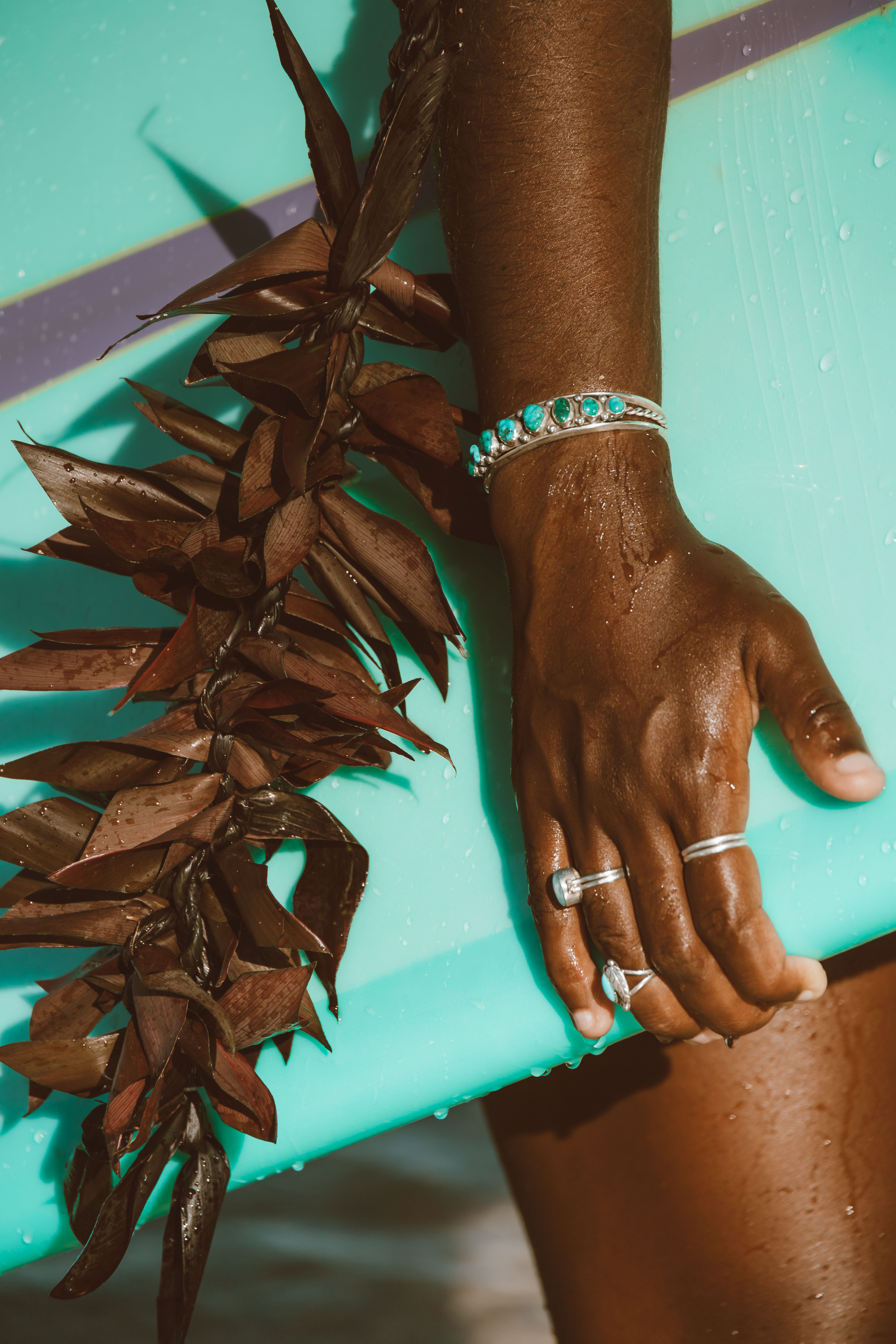 Close-up View of Hand Holding Surfboard · Free Stock Photo