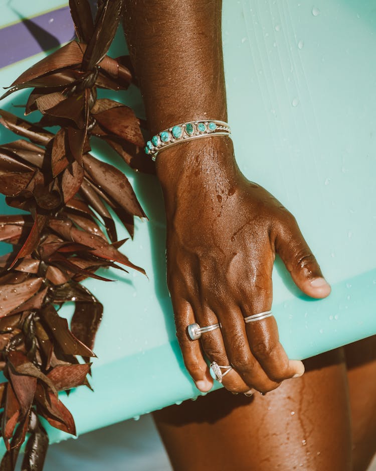 Hand Holding Surfboard