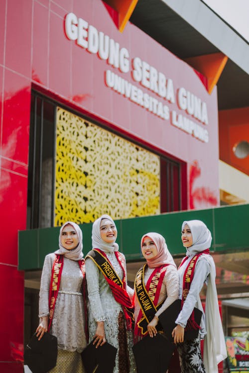 Free 2 Women Wearing White Hijab and White and Red Long Sleeve Shirt Stock Photo