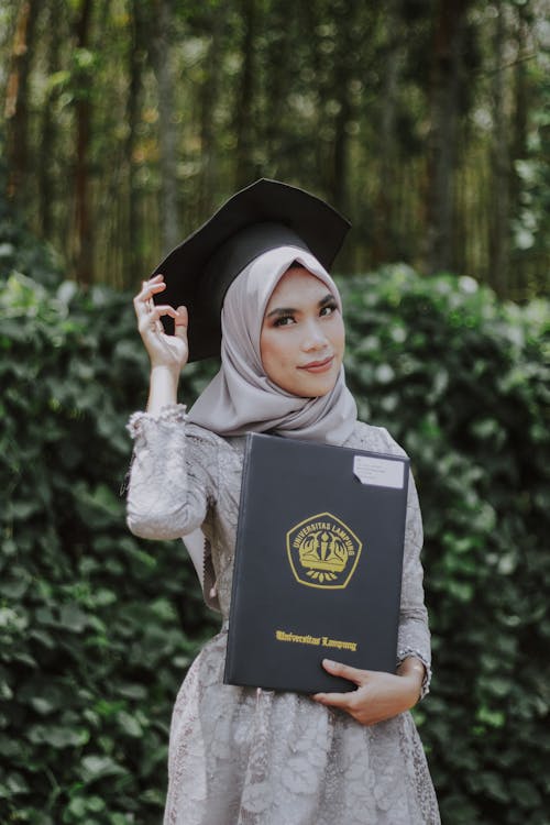 A Woman Wearing Black Graduation Hat