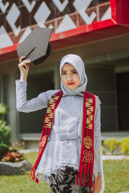 A Woman Holding Her Graduation Hat