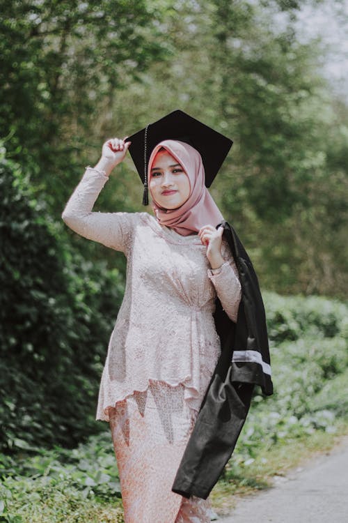 A Woman Wearing Black Graduation Hat