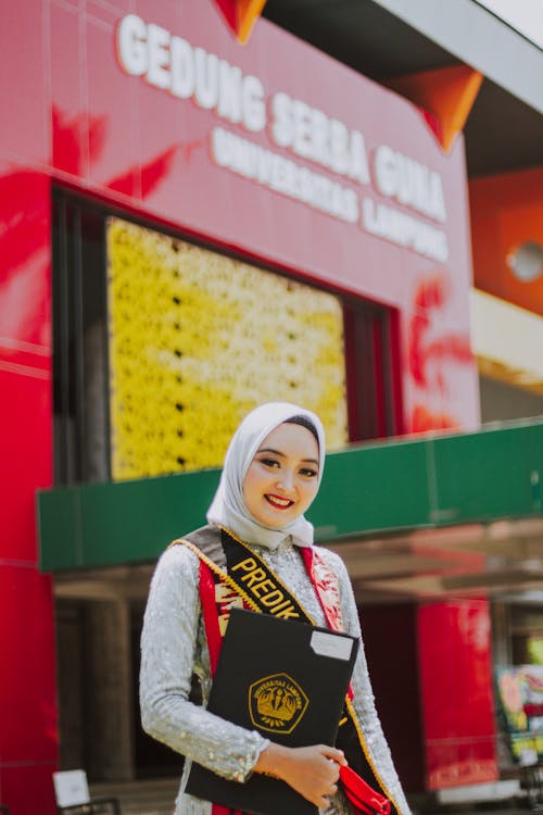 Hijabi Woman Posing with Diploma